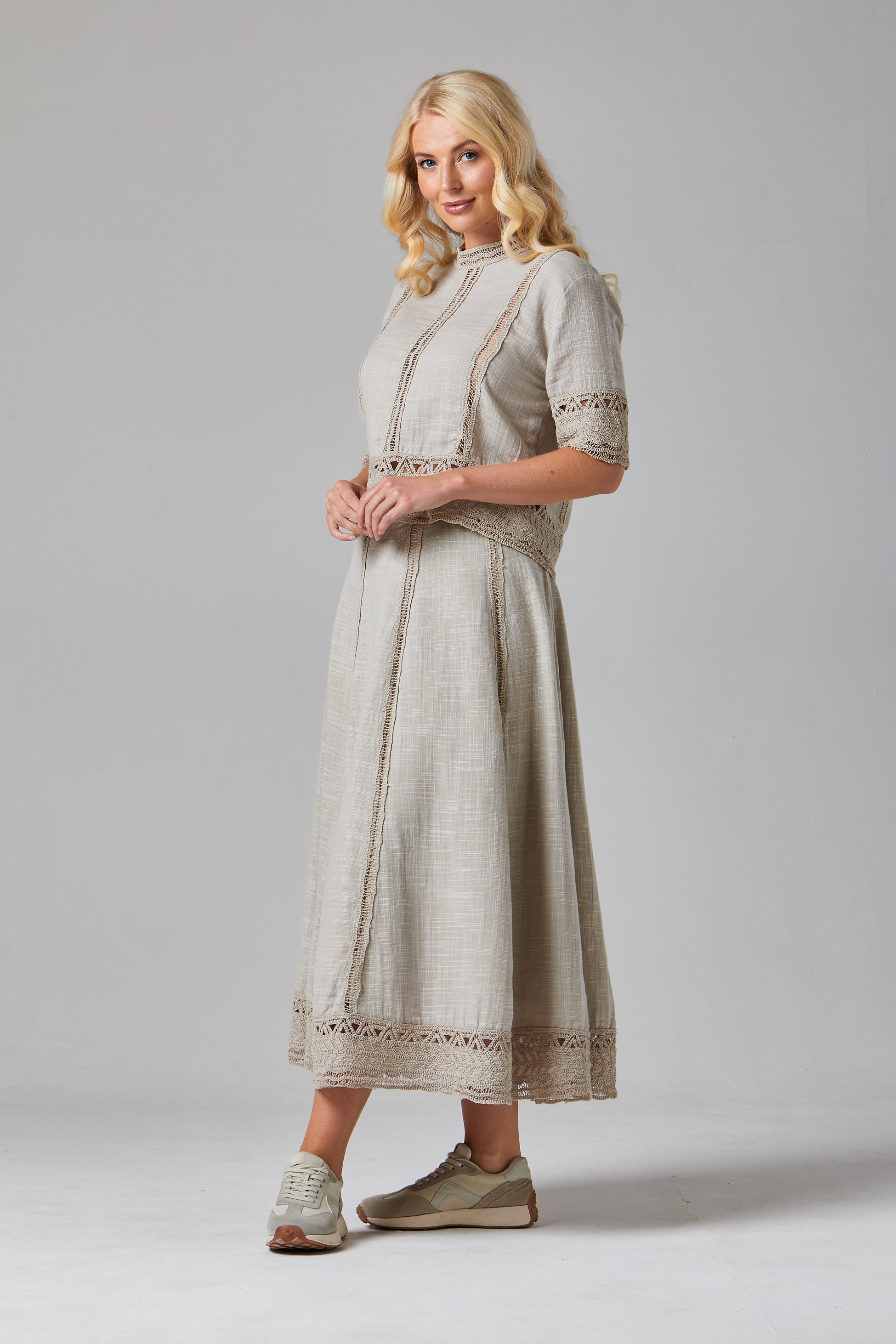 Francoise Top dress Woman wearing a beige outfit Woman wearing a vintage-style dress
