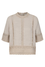 Francoise Top dress Woman wearing a beige outfit  Beige textured blouse