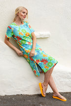 Buy Online Kylie Print Dress Alice Collins  Woman wearing a colorful floral dress