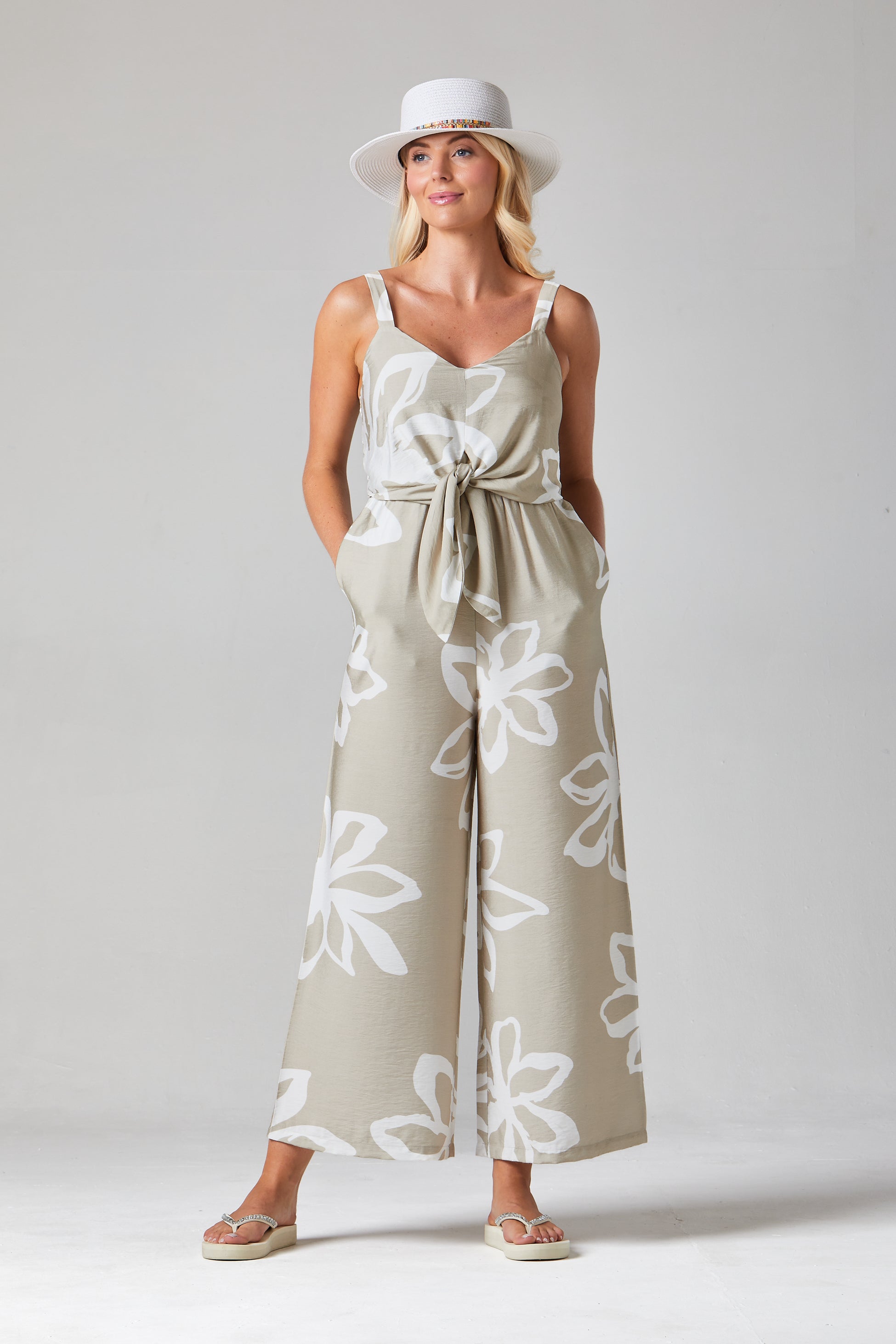 Buy Mairi Jumpsuit Floral Jumpsuite Online Alice Collins beige jumpsuit with white floral patterns