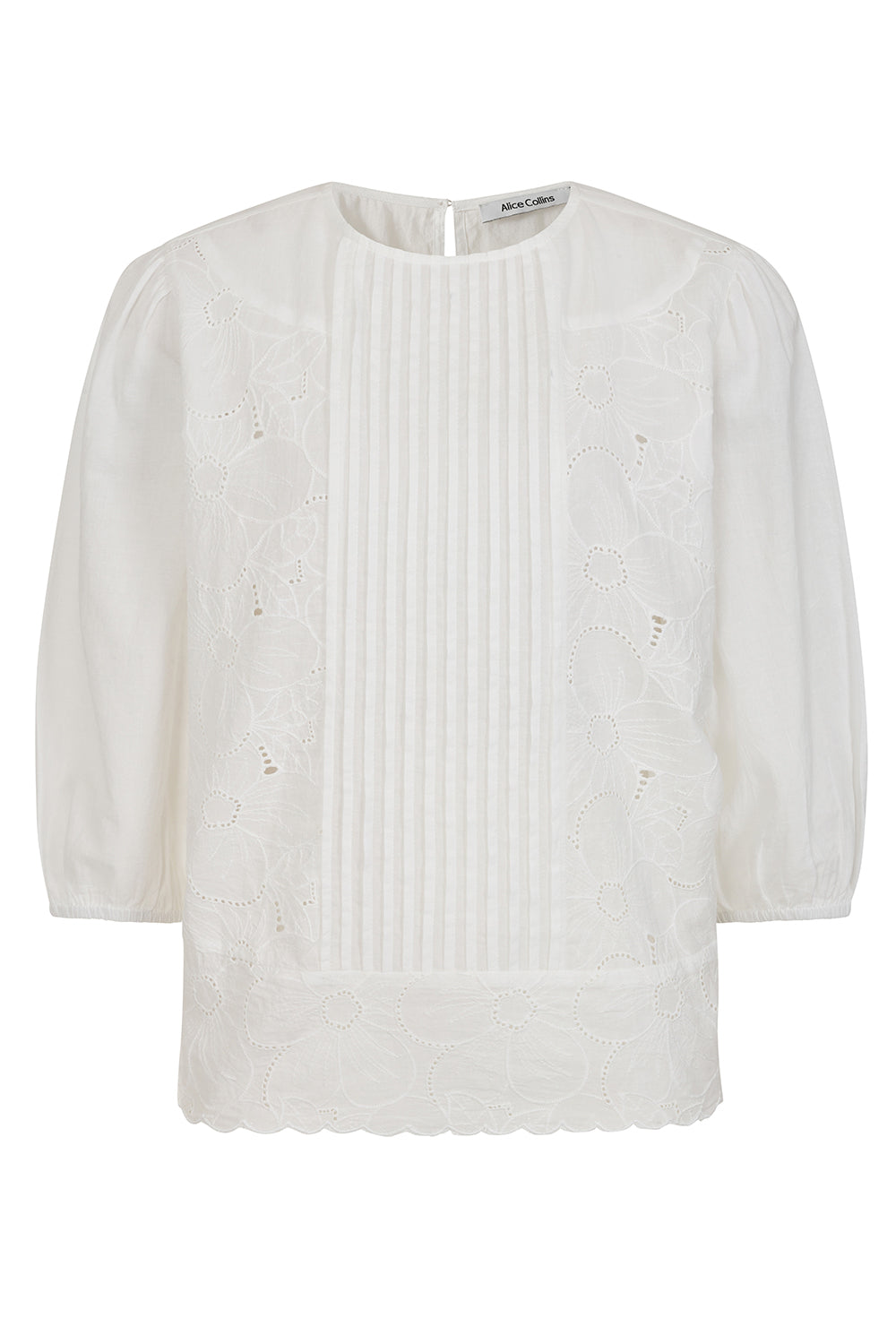 Buy Online Imogen Blouse Alice Collins White blouse with textured pattern on a white background