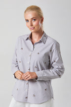 Buy Online Bella Shirt Alice Collins -  Woman wearing a light gray shirt with small patterns on a plain background