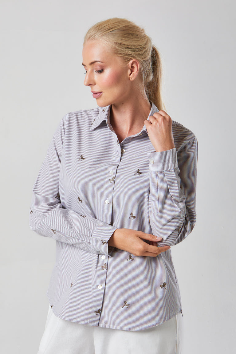 Buy Online Bella Shirt Alice Collins -  Woman wearing a light gray button-up shirt with small patterns on a plain background
